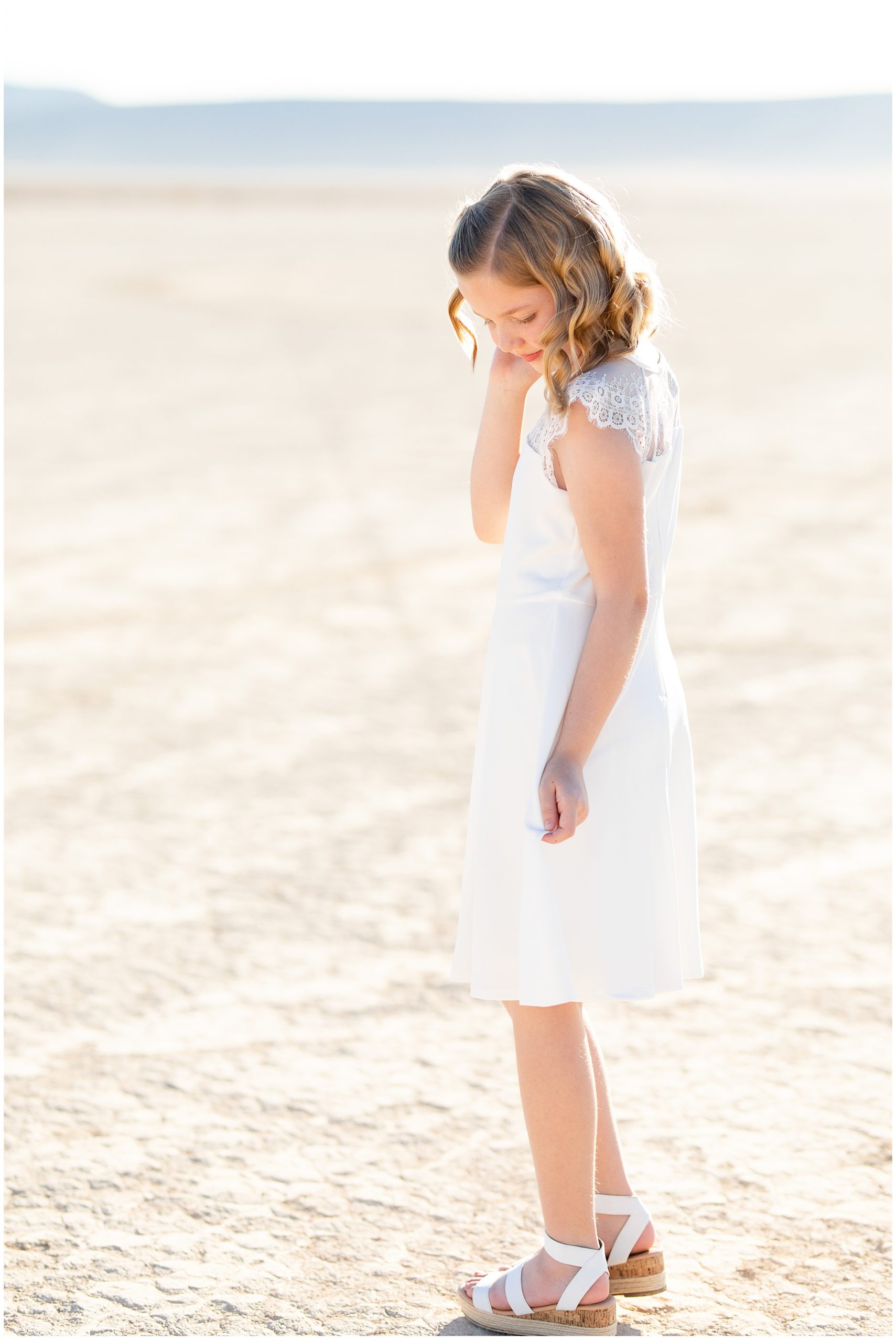 girl in white dress on dry lake bed, LDS baptism