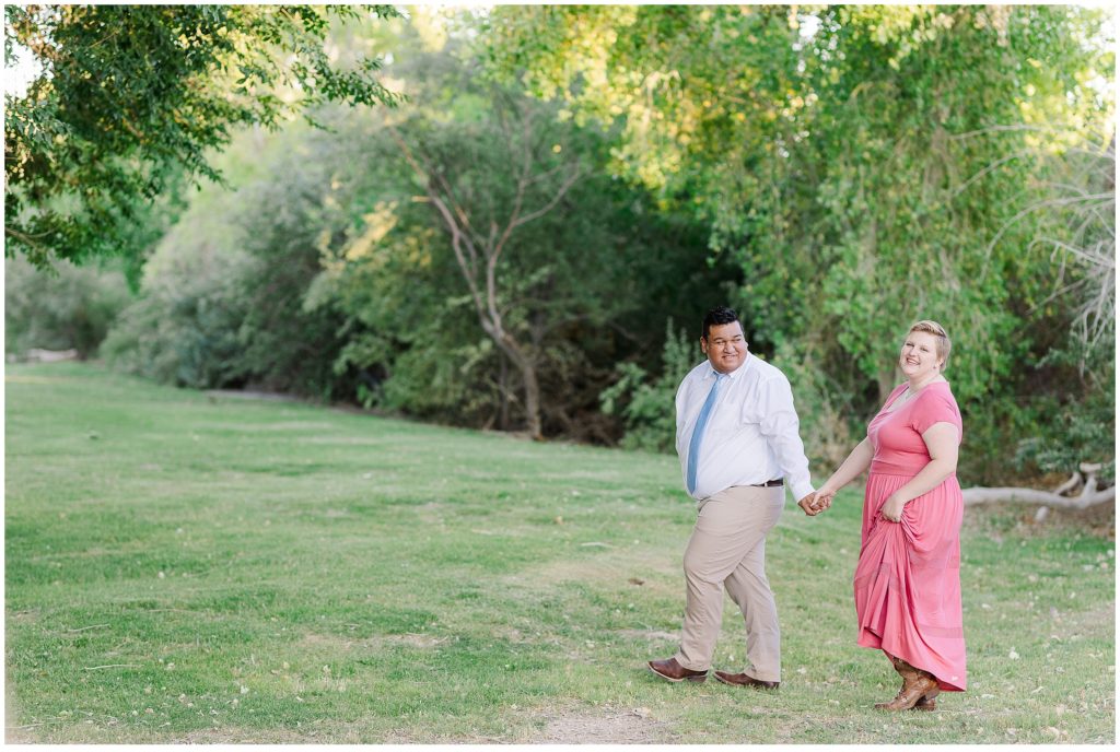 engaged couple, pink dress, walking